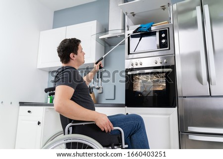 Similar – Image, Stock Photo Person with Grabber Reacher Tool