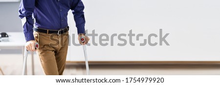 Similar – Image, Stock Photo Man with crutches or walking sticks leans back and supports himself on wet gray asphalt at the Golden Oldies classic car meeting in Wettenberg Krofdorf-Gleiberg near Giessen in Hesse in black and white