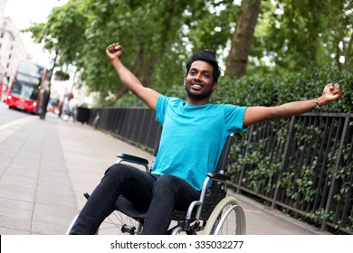 disabled man in a wheelchair celebrating