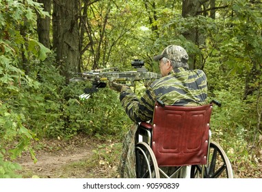 disabled man in wheelchair with a crossbow waiting for action