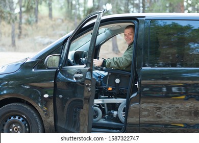 Disabled Man In Wheelchair Drive A Car