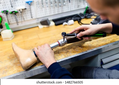 Disabled Man Working In Amputee Shop For Production Prosthetic Extremity Parts.