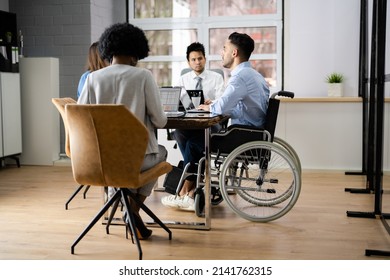 Disabled Mature Businessman Sitting At Desk With Laptop In Conference Room - Shutterstock ID 2141762315
