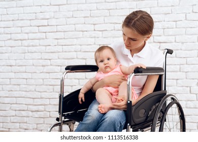 Disabled Mother In Wheelchair With Newborn Baby. Disabled, Motherhood Concept.