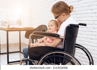 Disabled Mother In Wheelchair With Newborn Baby. Disabled, Motherhood Concept.