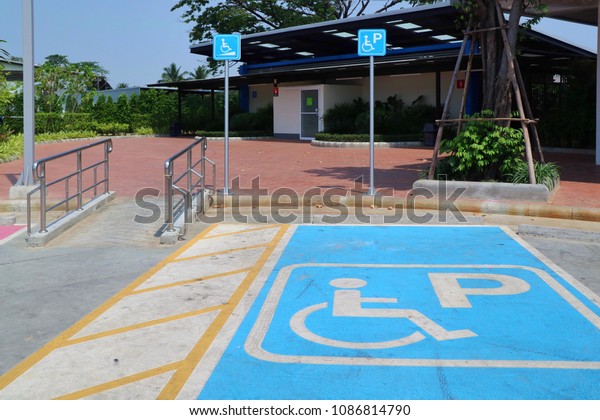 Disabled parking with blue parking sign. \
Sign\
and transportation\
concept.