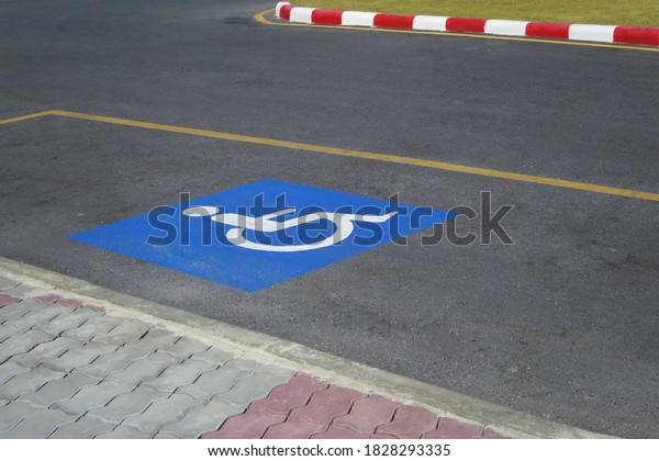 Disabled parking with blue parking sign. Sign\
and transportation\
concept.