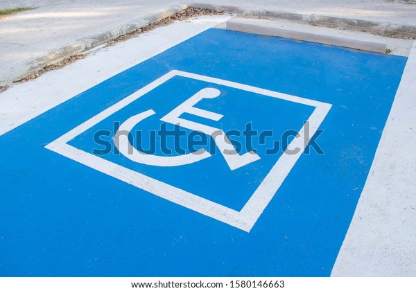 Disabled parking cars for handicapped driver.\
Wheelchair parking car in the urban\
city.