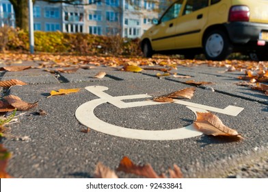 disabled parking permit sign painted on the street