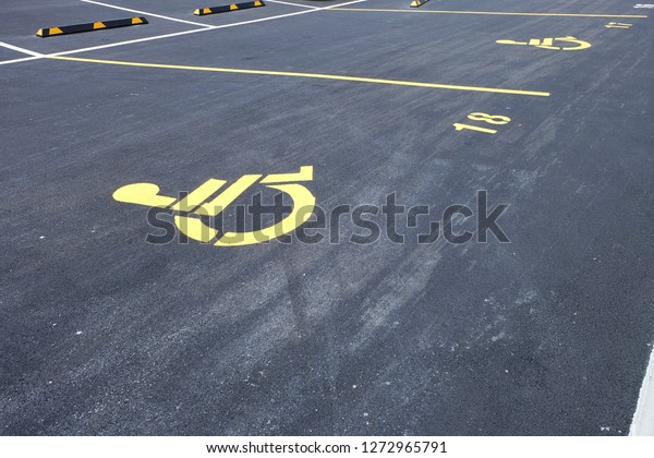 Disabled\
parking sign at the car park in New\
Zealand