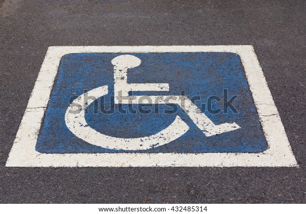 Disabled Parking\
sign at parking lot on\
street.