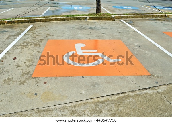 disabled parking sign painted\
