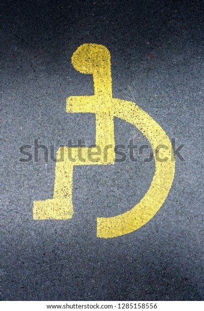 Disabled parking space, handicapped\
parking spot, the universal sign for people with wheelchairs and\
disabilities. Disabled badge holds, blue badge holders\
uk