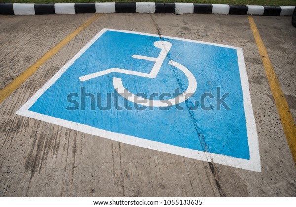 Disabled parking space and wheelchair way on area in\
car park