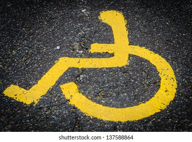 A 'disabled' Parking Spot In A UK Car Park Marked Out In Yellow Paint