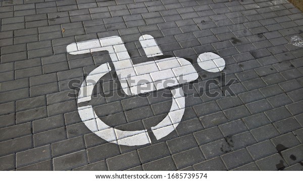 disabled parking tile sign\
in the city