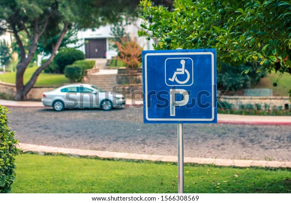 Disabled parking or wheelchair parking sign\
In the parking on the street, do the parking for the disabled,\
slope area for\
wheelchairs.
