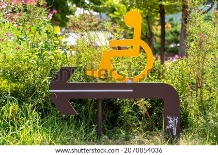 Disabled person dedicated passage guide sign Stock photo © 