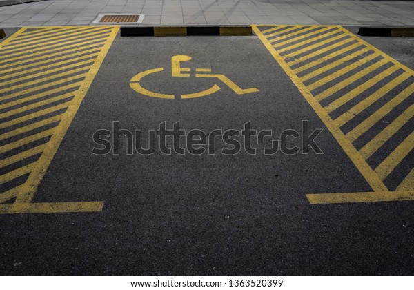 Disabled person\
sign on the parking lot\
reserved