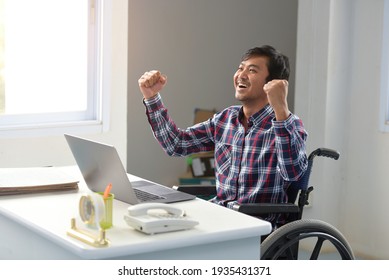 Disabled Person In The Wheelchair Works In The Office At The Computer Happy Young People With Disabilities Working In The Office Day Of Disabled Persons