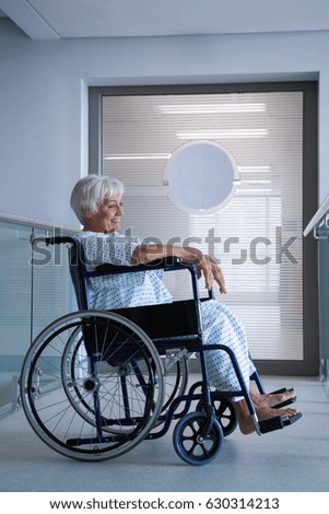 Similar – Senior woman in wheelchair alone in room