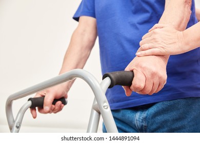 Disabled Senior With Walker In Physiotherapy Or Occupational Therapy
