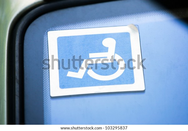 Disabled sign on the car\
glass