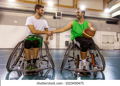 Disabled Sport Men In Action While Playing Indoor Basketball At A Basketball Court