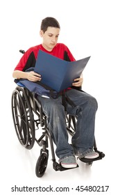 Disabled Teen School Boy Reading In His Wheelchair.  Full Body Isolated.