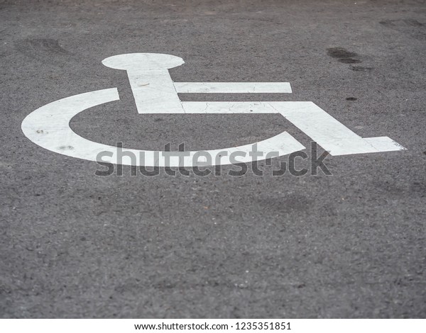 Disabled user\
car park space with wheelchair\
symbol.