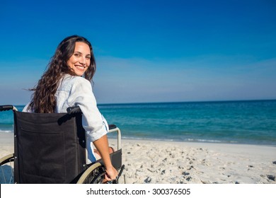 Disabled woman looking at camera on a sunny day - Powered by Shutterstock