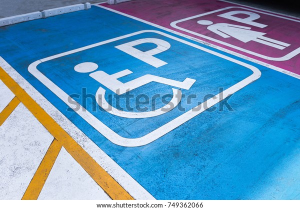 disabled and woman parking\
sign