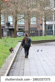 Disabled Woman Walking Her Dog In Tier 4 Lockdown Area In London UK December 2020