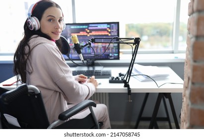 Disabled woman works as radio presenter in wheelchair in studio. Cybersport for disabled people concept