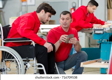 Disabled Worker In Wheelchair In A Carpenters Workshop