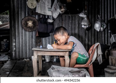 Disadvantaged Children doing homework.