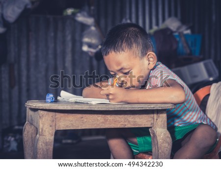 Disadvantaged Children doing homework.