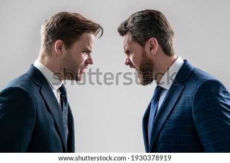 disagreed men partners. business competition. businessmeeting. struggle for leadership. displeased colleague dispute. negotiations. businessmen talking and discussing conflict. boss and employee.