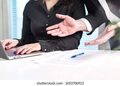 Disappointed or angry boss yelling at employee. Unhappy manager talking to bad assistant or secretary. Businessman spreading hands in office with coworker woman. Business discussion or problem.