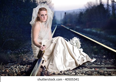 Disappointed bride on a railway