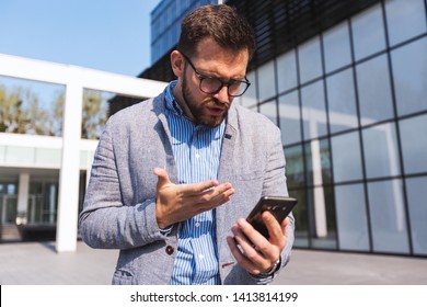 Disappointed Businessman With A Phone