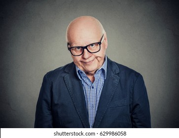 Disappointed elderly man looking at camera  
