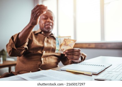 Disappointed Elderly Man Sitting On Couch In Living Room Feels Frustrated By Bad News, Reading Paper Postal Correspondence, Bank Notice About Debt, Notification Of Eviction, Negative Letter Concept