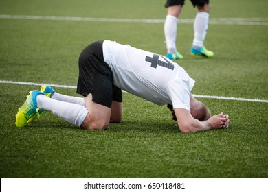 Disappointed football player - Powered by Shutterstock