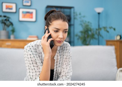 Disappointed Girl Sits And Talks On The Phone With Her Boyfriend, Friend, She Is Upset, Argues On The Phone, Indifferent Expression On Face, Listens Carefully To Caller, Tries To Explain The Situation