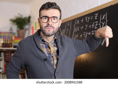 Disappointed Teacher Giving A Thumbs Down 