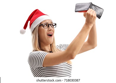 Disappointed Woman With A Christmas Hat Holding An Empty Wallet Isolated On White Background