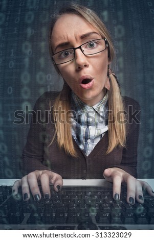 disappointed woman  typing on a keyboard in front of a computer screen