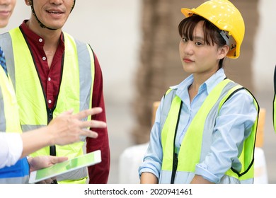 Disappointed Young Woman Factory Worker Or Engineer Meeting And Listening Before Start A Work In Warehouse Storage