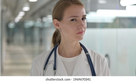 Disapproving Female Doctor Shaking Head, No Sign 